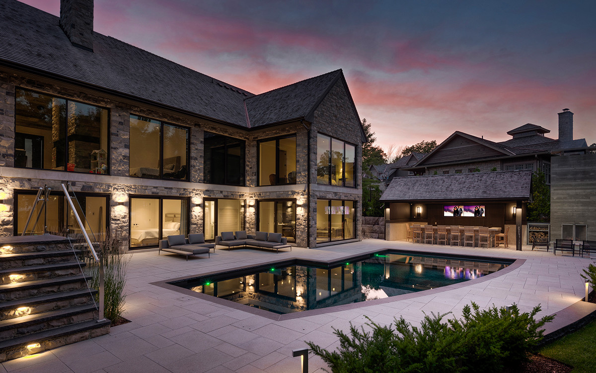 house at dusk with pool
